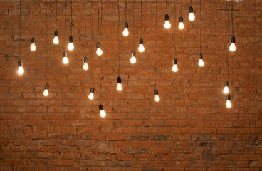 Light bulbs over brick all texture