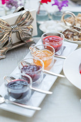 Different Berry Jam in Beautiful Glass Jars, Breakfast Time in Restaurant