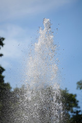 Obraz na płótnie Canvas fountain splash water on a background of blue sky 