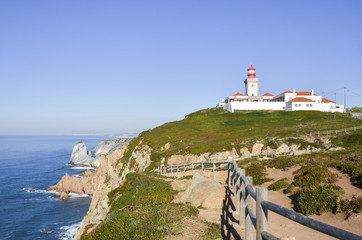 Fototapeta na wymiar Roca cape in Portugal. Lighthouse on the edge.