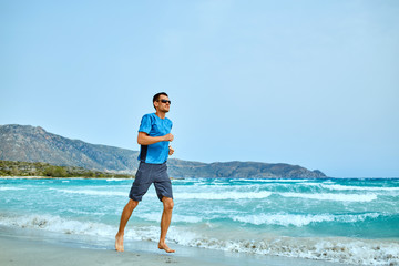 Fototapeta na wymiar man running on the beach