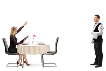 Blond woman calling a waiter