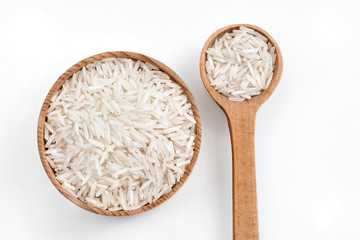 Rice in wooden spoon and bowl on white background.  Top view, high resolution product.