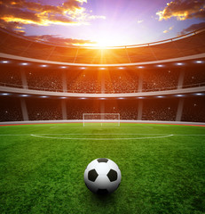 Fototapeta na wymiar Soccer ball on green stadium
