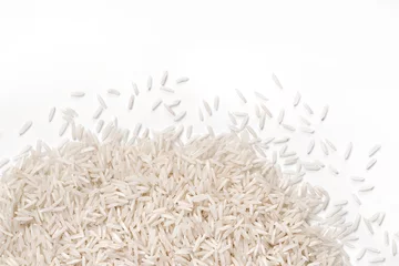Fototapeten Close up of white rice  on white background. Top view, high resolution product. © Romario Ien