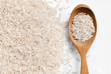 Wooden spoon with raw rice. Close up,top view, high resolution product.