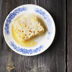 Still life with honey, honeycomb, pollen