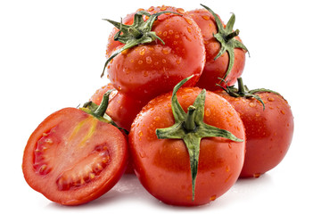 Pile of fresh ripe wattled tomatoes, one cutted, isolated on white background