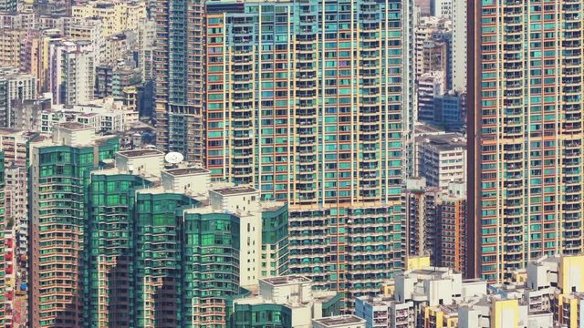 Time-lapse camera pan across super dense office blocks and apartments, Hong Kong