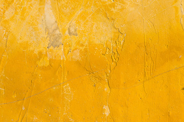 Rough texture yellow wall closeup