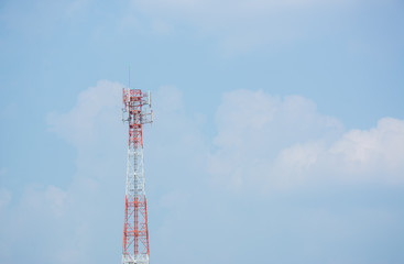 Phone antenna on a blue sky.