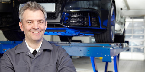 Car mechanic in a garage