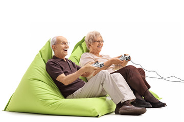 Elderly couple playing video games © Ljupco Smokovski
