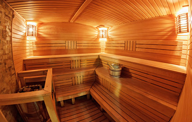 Light wooden sauna with bench