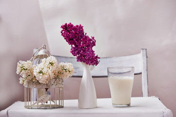 A glass of milk and bowl of insipidity. White background on the suitcase