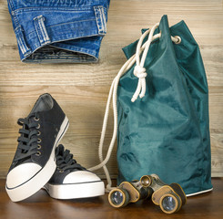 Shoes, backpack, jeans and  binoculars