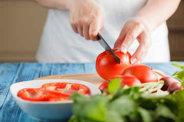 Obraz na płótnie Canvas Diced tomatoes on a cutting board