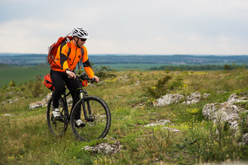 Fototapeta premium Young man is riding bicycle outside. Healthy Lifestyle.