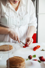 Woman Cutting Strawberries