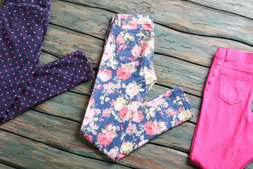 Dark navy and pink trousers. Folded pants with different print. Choose what suits you best. Colors and prints.