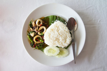 Thai spicy food, squid with basil, and heart shape rice
