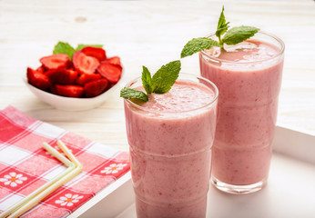 Healthy tasty milk cocktails with strawberries and banana.