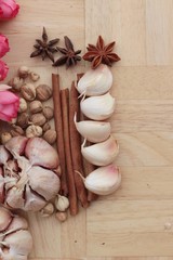 Garlic has health benefits on wood background