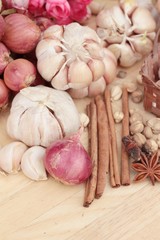 Shallot and garlic for cooking on wood background.