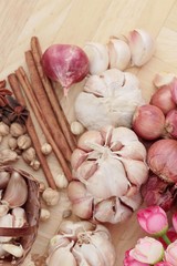 Shallot and garlic for cooking on wood background.