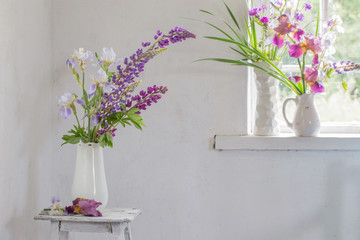 Flower vase sitting inside of window
