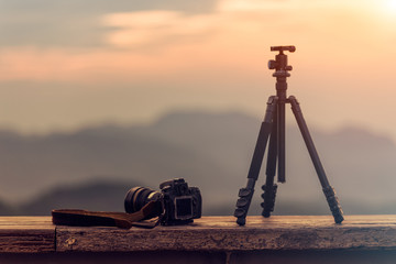 Travel photographer equipment with beautiful landscape on the ba
