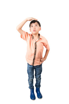 Little boy checkin his height on white background