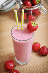 Strawberry smoothie or milkshake in the glass jar, healthy concept
