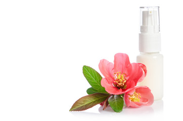 Obraz na płótnie Canvas Face cream bottle with pink flower isolated on white
