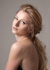 Naklejka premium Beautiful face of young woman with perfect skin