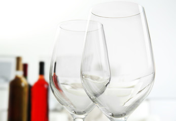 Wineglasses on blurred interior background