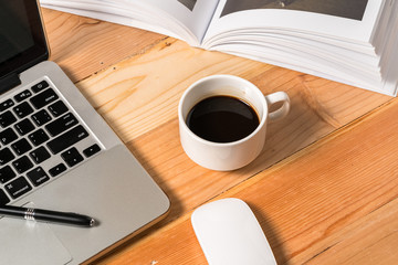 Workplace, laptop and tablet pc on wooden table
