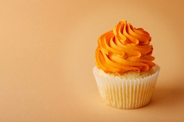 Birthday cupcake on color background