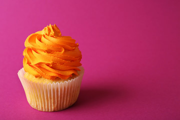 Birthday cupcake on pink background