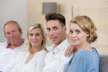 Obraz premium happy family relaxing on sofa