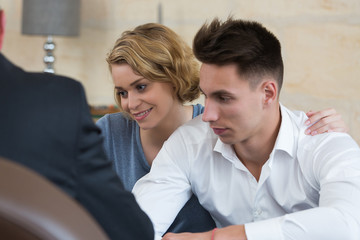couple signing loan contract