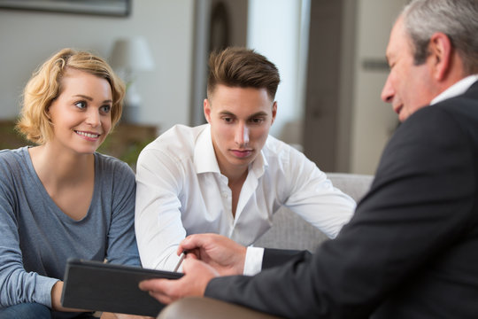 couple meeting financial adviser for investment
