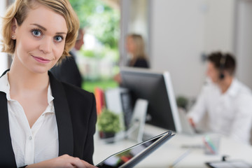 business woman with her staff, people group in background at office