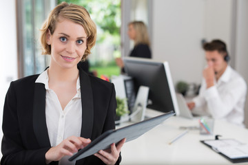 business woman with her staff, people group in background at office