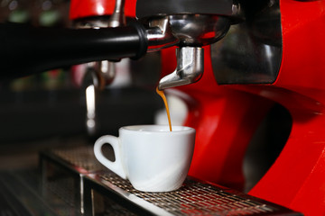 Coffee machine with cup, close-up