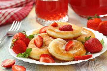 Pancakes with sugar powder and strawberry