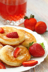Pancakes with sugar powder and strawberry