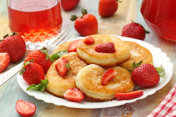 Pancakes with sugar powder and strawberry