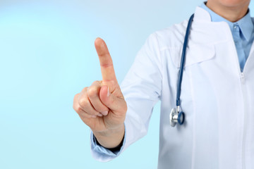 Professional doctor making gesture on blue background