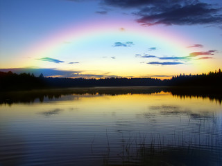 Sunset over the lake and forest